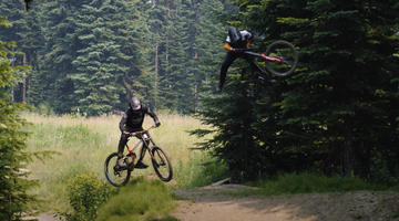 Bas van Steenbergen and Matt Macduff jumping mountain bikes